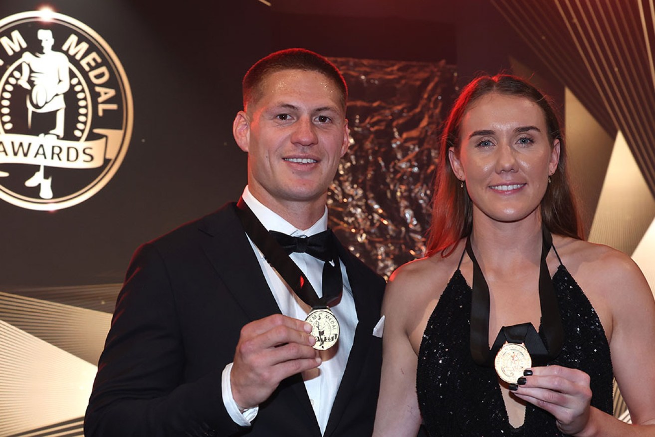 Star Newcastle fullbacks Kalyn Ponga and Tamika Upton with their Dally M Medal on Wednesday night.