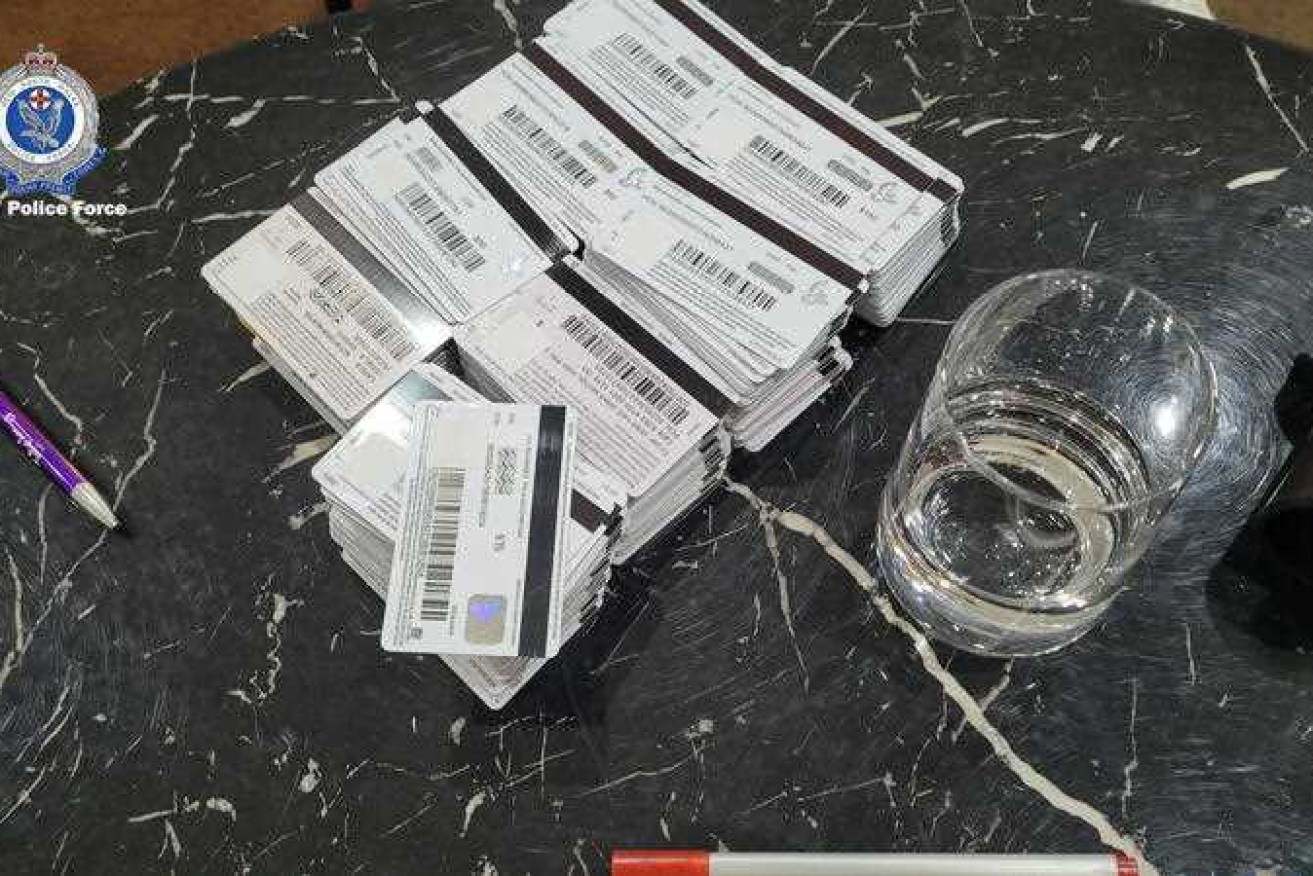 Two men have been arrested after credit cards were seized by police from a Sydney property.