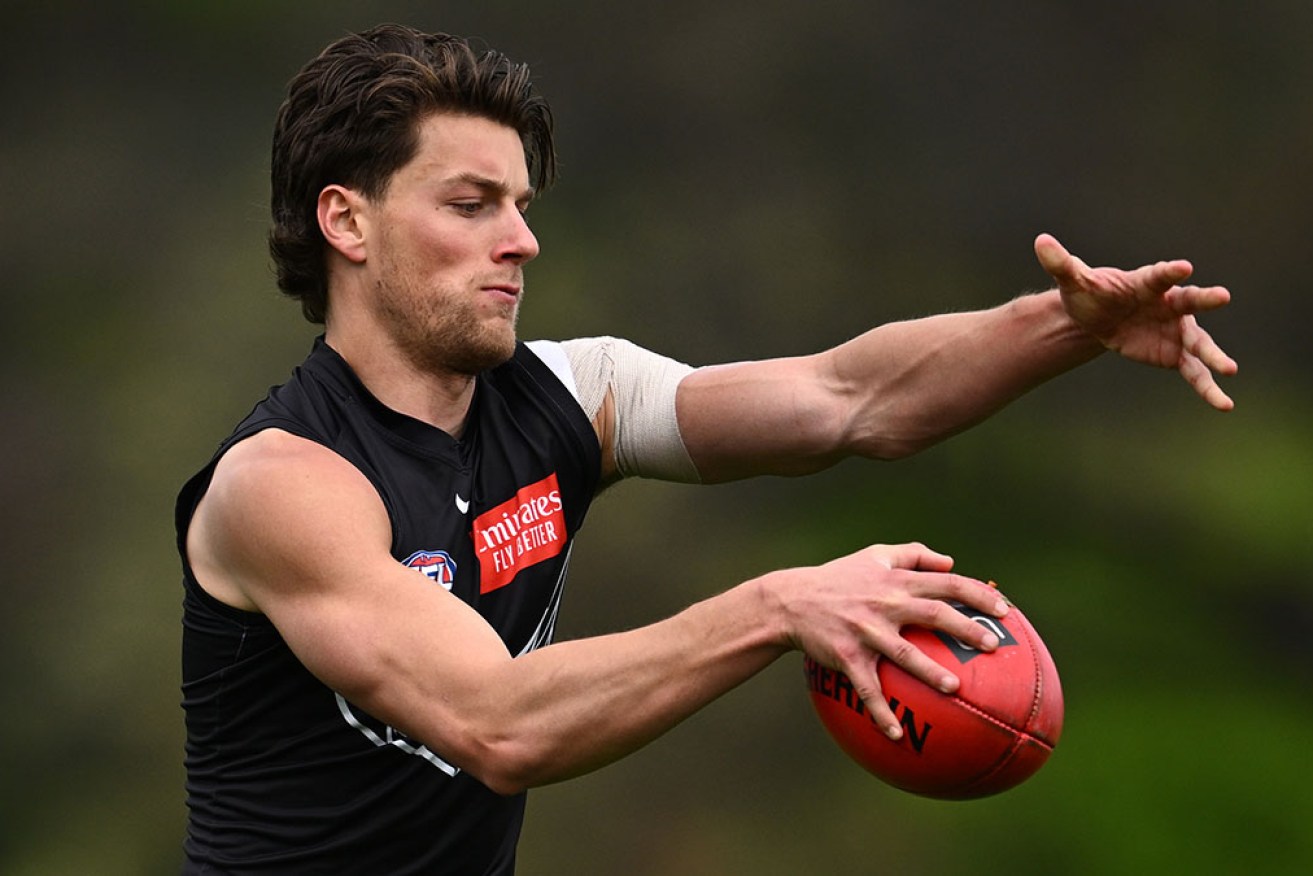 Patrick Lipinski drops out of the Collingwood starting side to be their sub in the AFL grand final. 