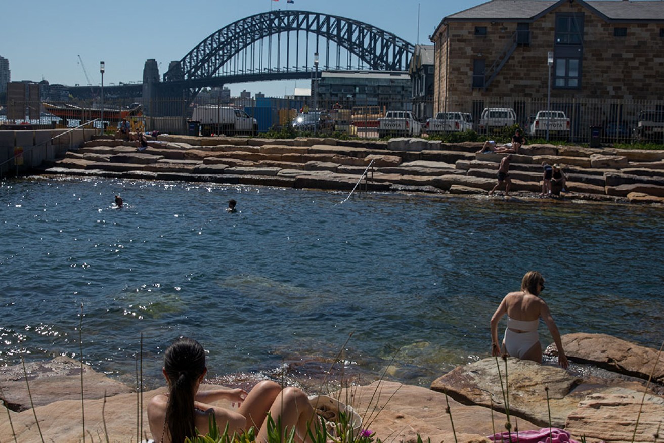 Temperatures reached 37 degrees in some Sydney suburbs as fire crews battled blazes throughout NSW.