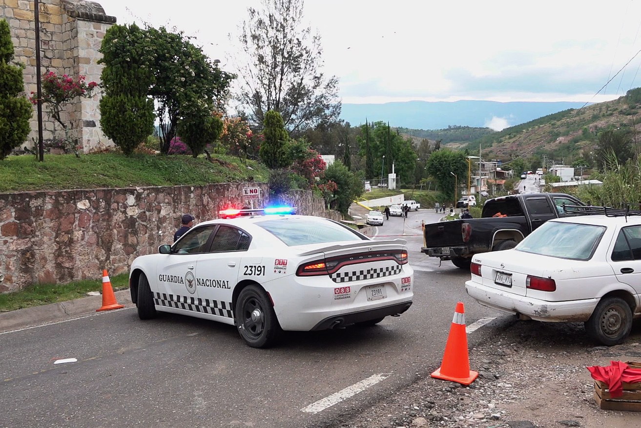 National Guard (GN) personnel guard the area where a passenger bus crashed in the municipality of Tlaxiaco, Oaxaca state, Mexico, 05 July 2023. 