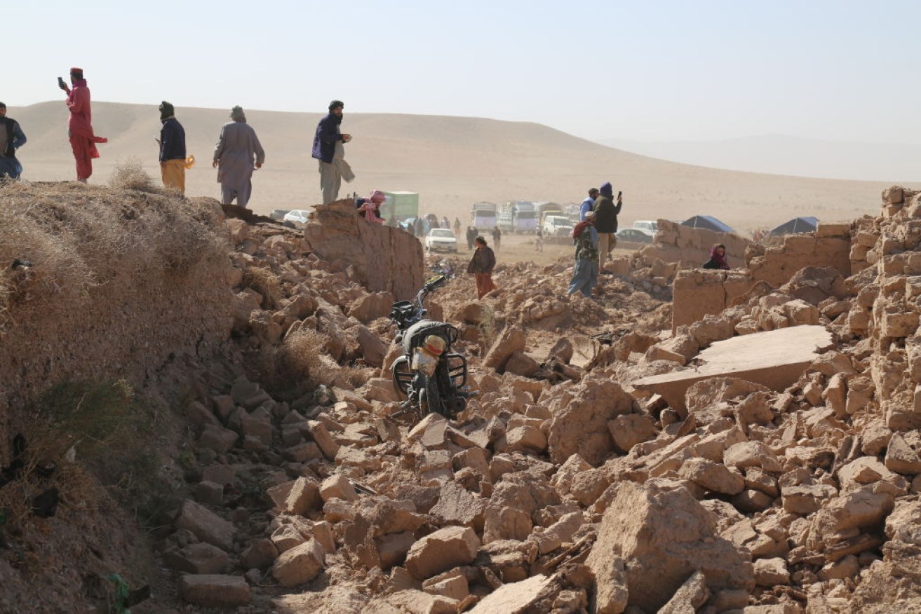 An Afghan boy stands amid debris after a powerful earthquake in Herat province in Afghanistan.