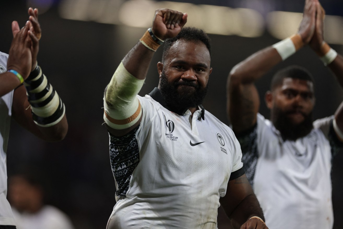 Fiji's prop Mesake Doge and teammates salute their supporters after Sunday's match.