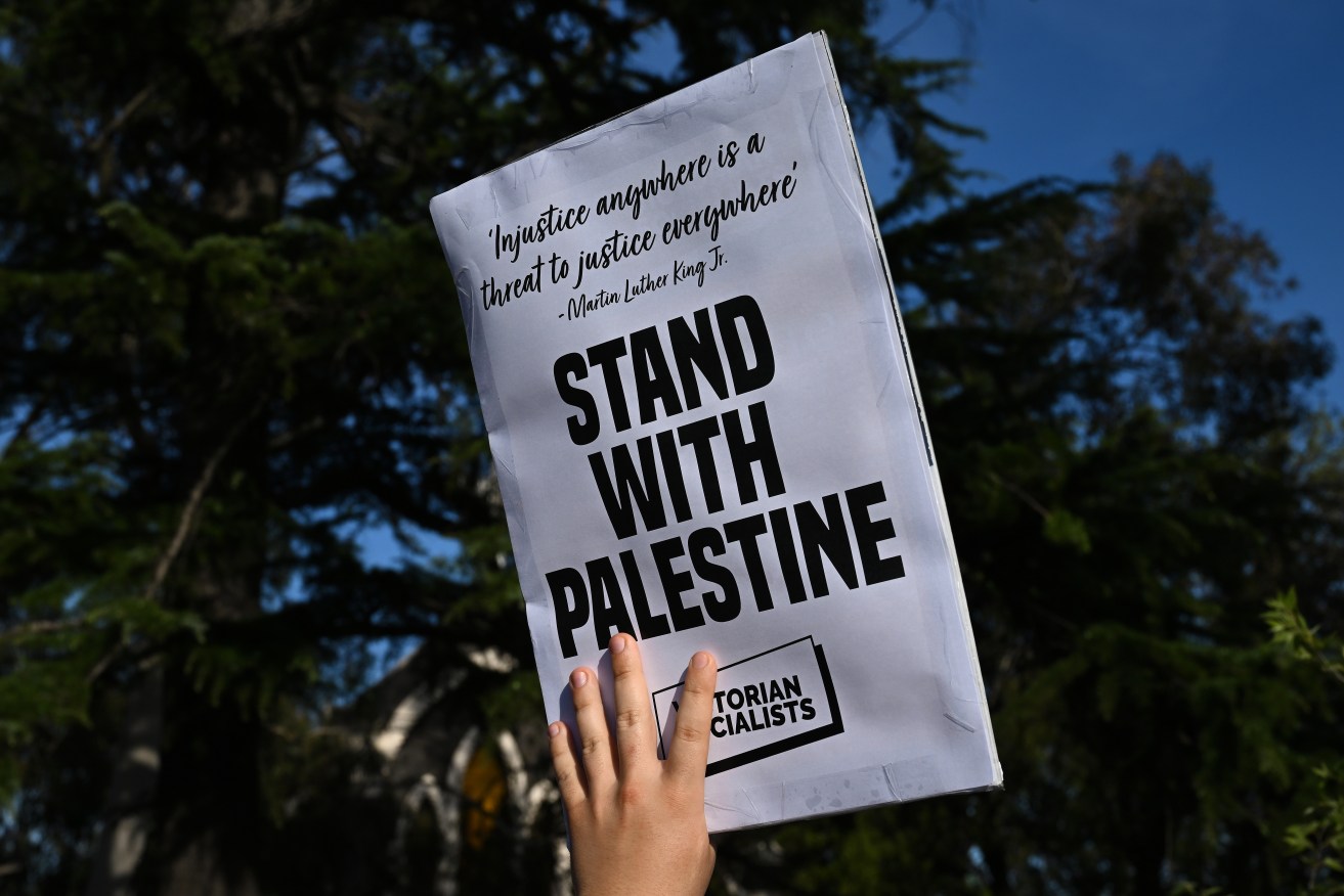 People participate in a Free Palestine demonstration in Coburg, Melbourne, Thursday, October 19, 2023. Several marches for Palestine are planned around Australia. (AAP Image/James Ross) NO ARCHIVING