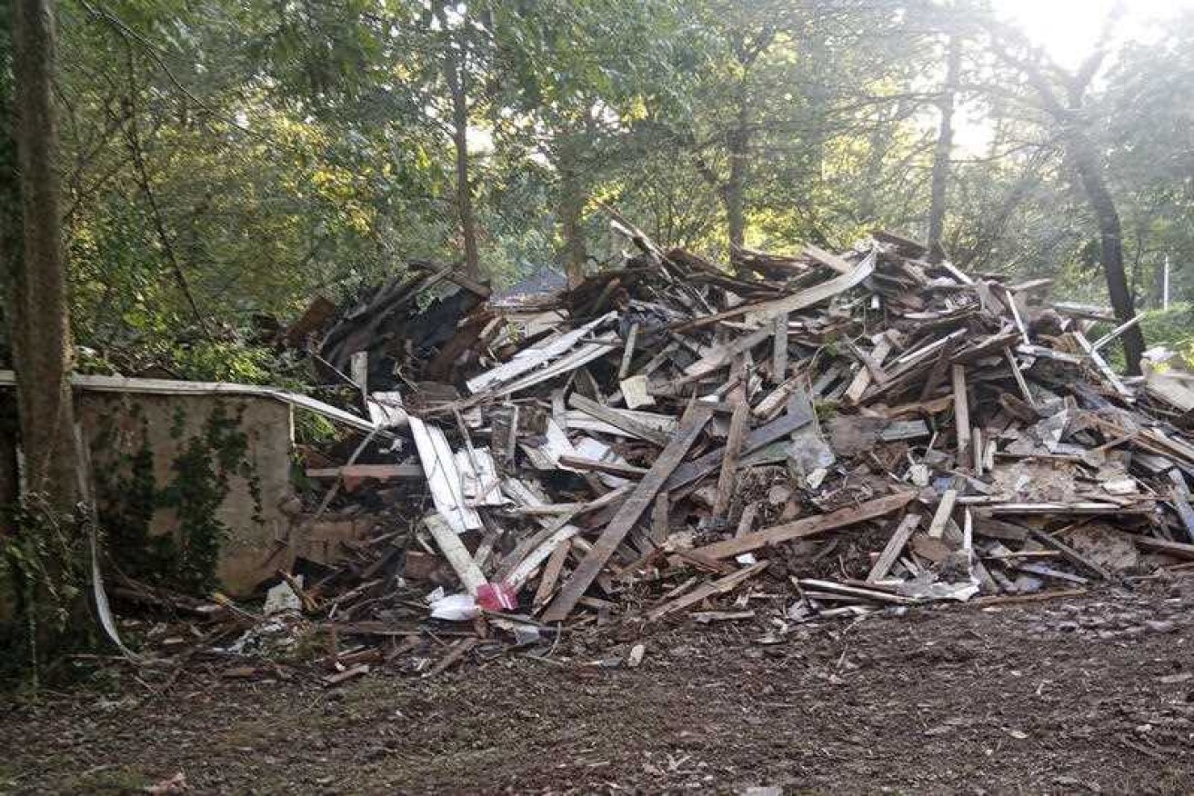 A mistakenly demolished house in Atlanta has been reduced to a pile of timber and debris.