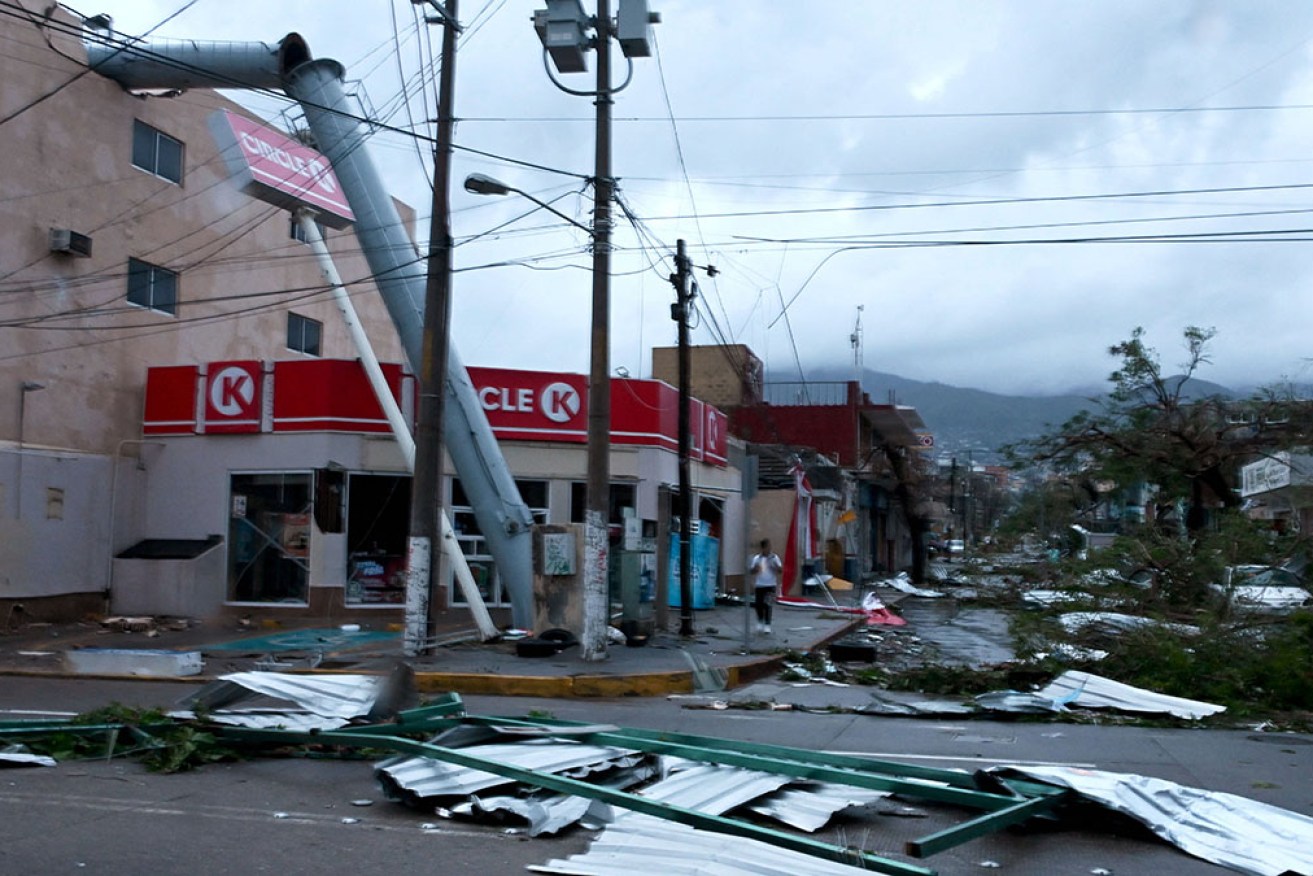 Authorities rushed to restore communications and assess damage in the beach resort of Acapulco after the powerful hurricane.