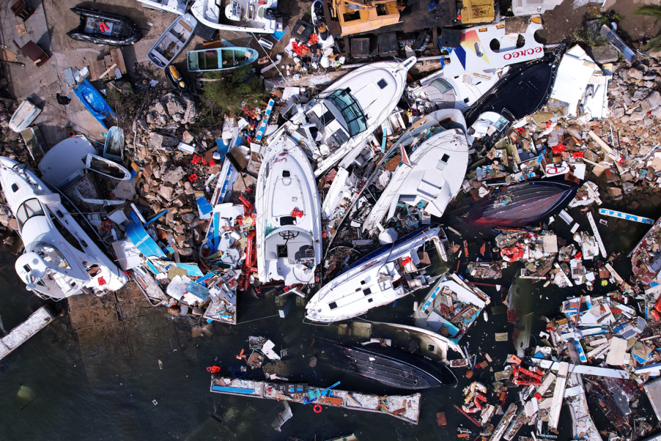 A tangled jumble of smashed yachts testifies to the strength of Hurricane Otis' fury.
