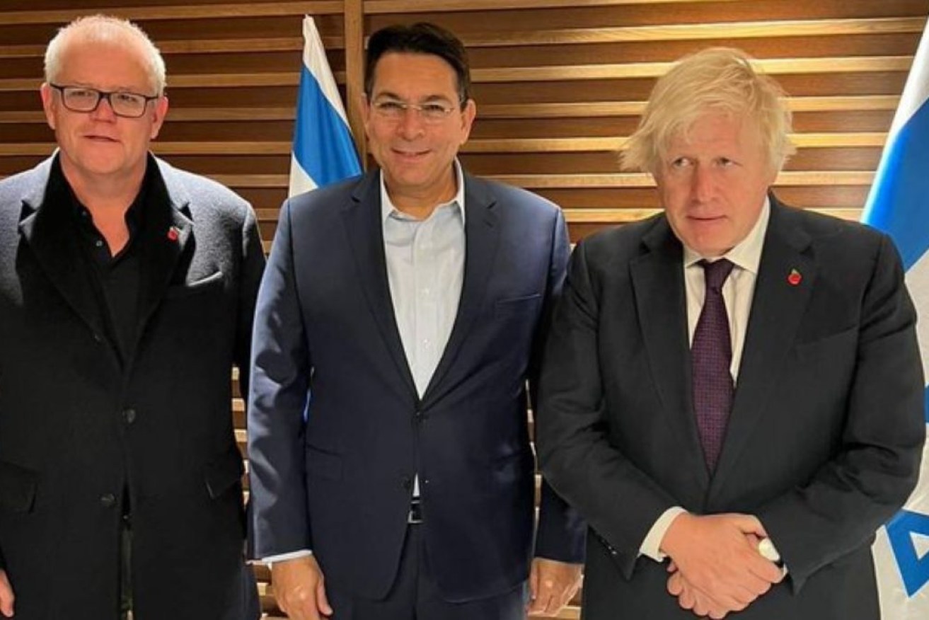 Former PMs Scott Morrison and Boris Johnson are welcomed by Israel's UN representative Danny Danon. 