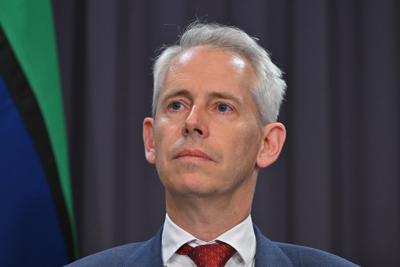 Minister Andrew Giles says the refugees released will have to regularly report to authorities.