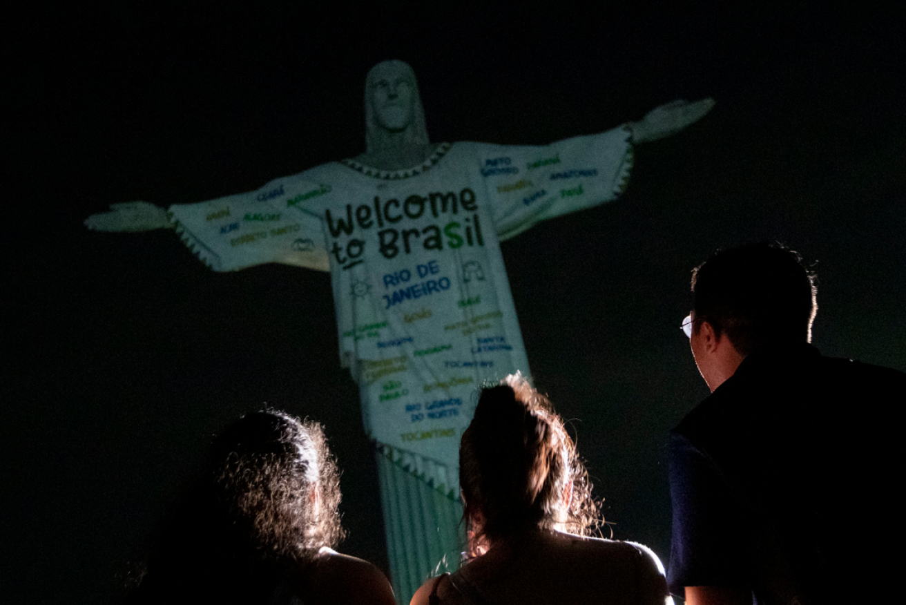 Rio's Swifties  fan got to light up Christ the Redeemer. They showed their gratitude by feeding the poor.