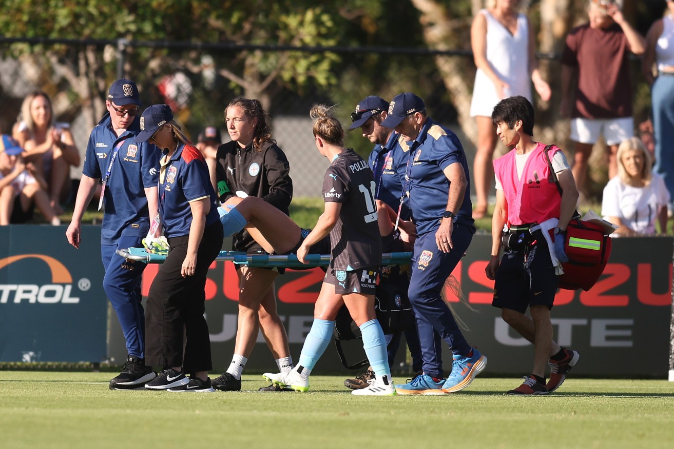 Melbourne City match winner Holly McNamara leaves the field on a stretcher against Newcastle on Sunday. 