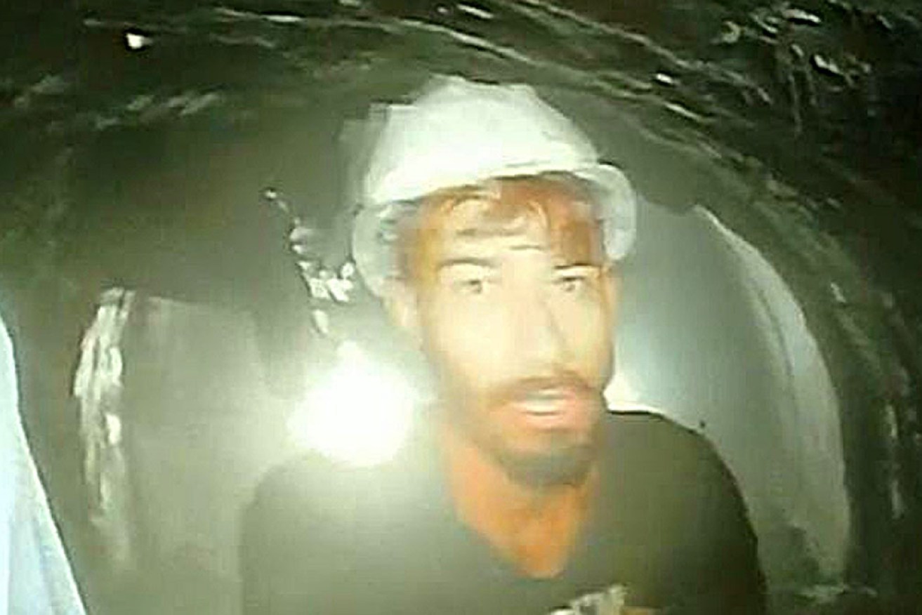 A group of 41 men trapped in a highway tunnel in the Indian Himalayas have been seen in a video.