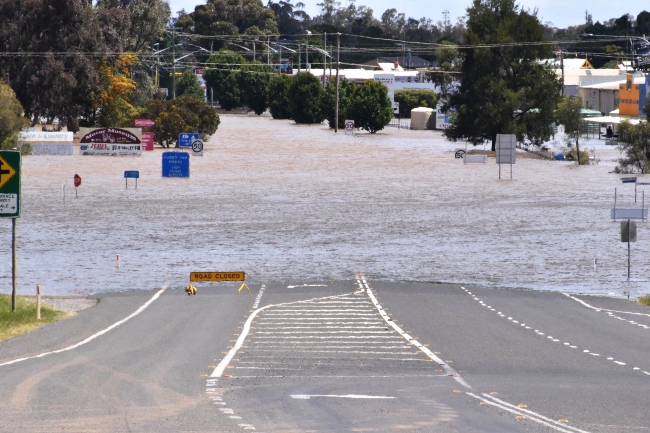 A man has been charged over the death of a five-year-old boy was trapped in a car in floodwaters. 