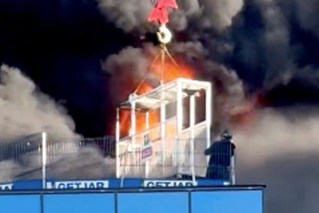 ‘Terrifying’: Crane plucks man from burning hi-rise