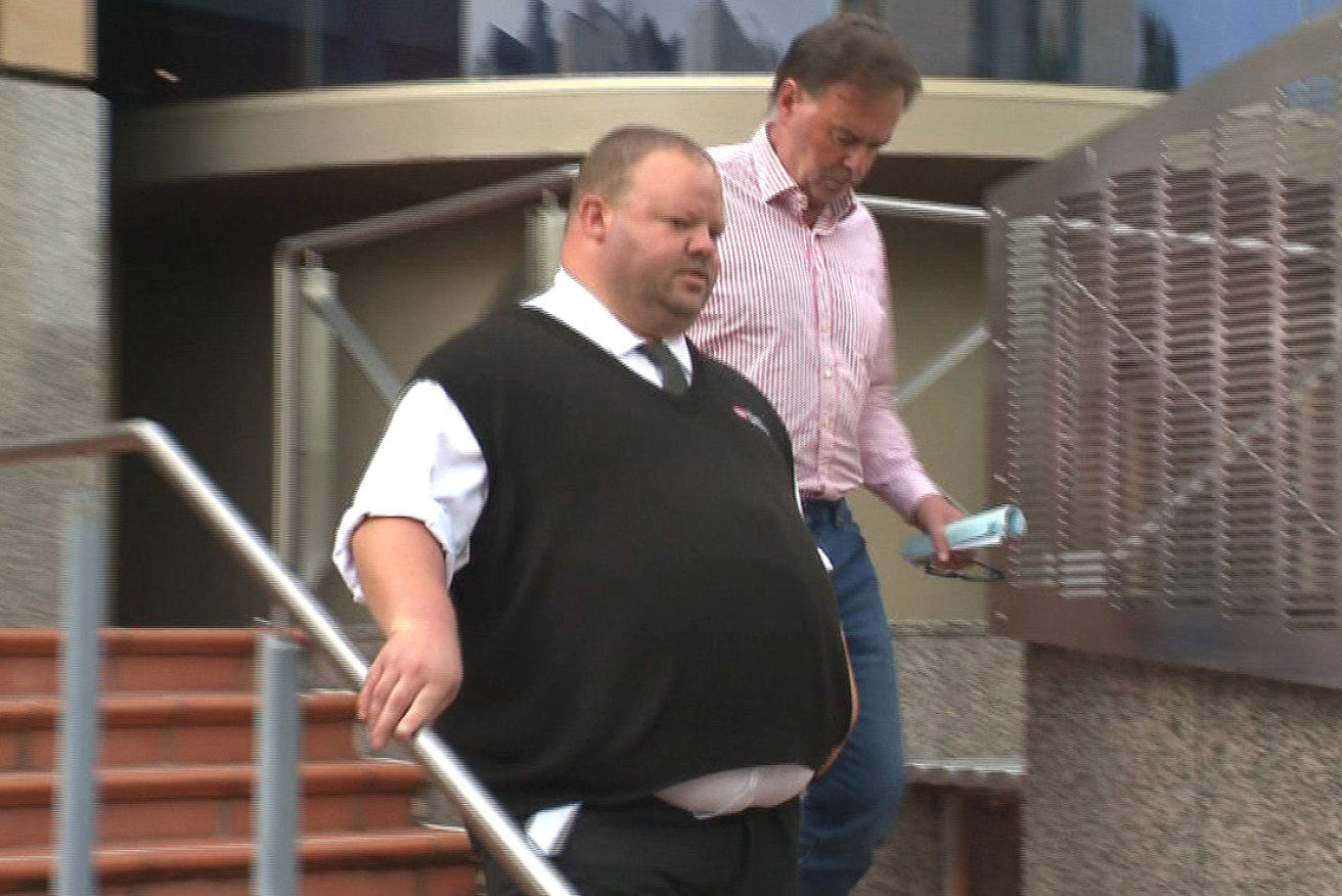 Justice Gregory Geason (r) leaves court on Friday.