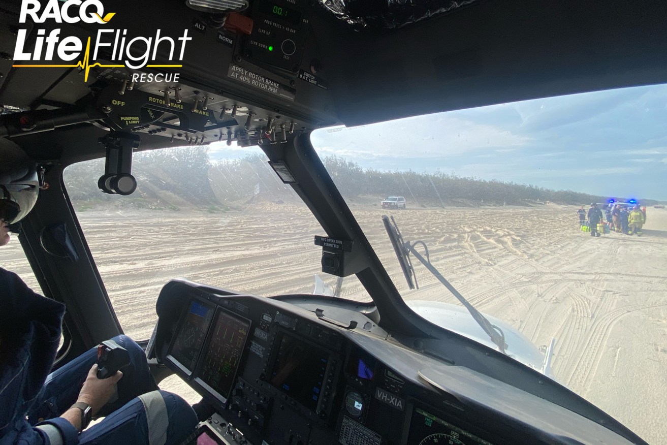A man has been airlifted to hospital after he was buried in sand on an island in Moreton Bay.