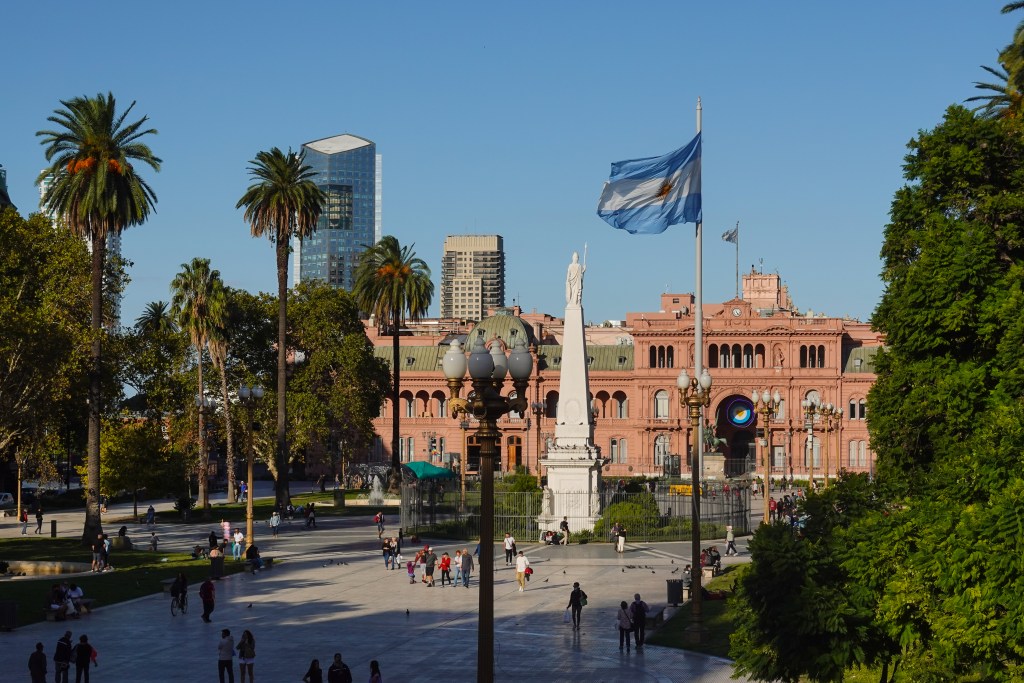 Argentinian flag flying over the Plaza de Mayo square in the heart of Buenos Aires historical district in Argentina capital city