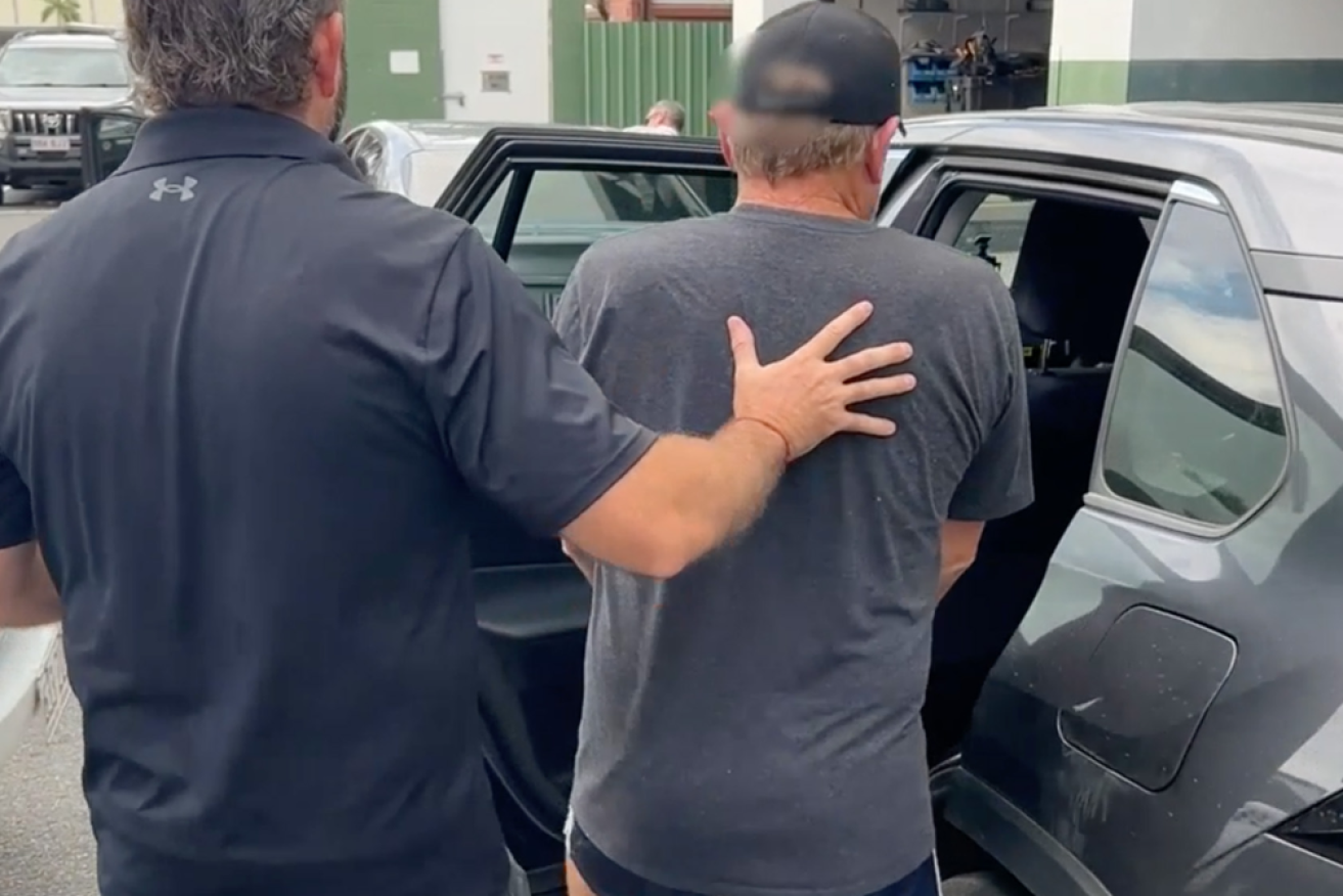 An alleged member of the smuggling ring is taken into custody.