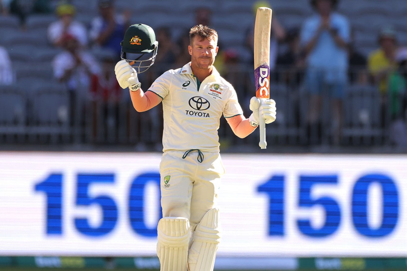 Australian opener David Warner celebrates reaching 150 in the first Test against Pakistan in Perth.