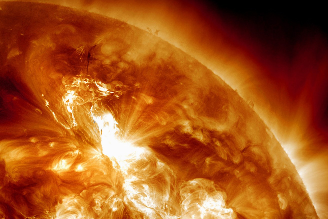 Scientists are monitoring a part of the sun that spit out a flare for a possible outburst of plasma.