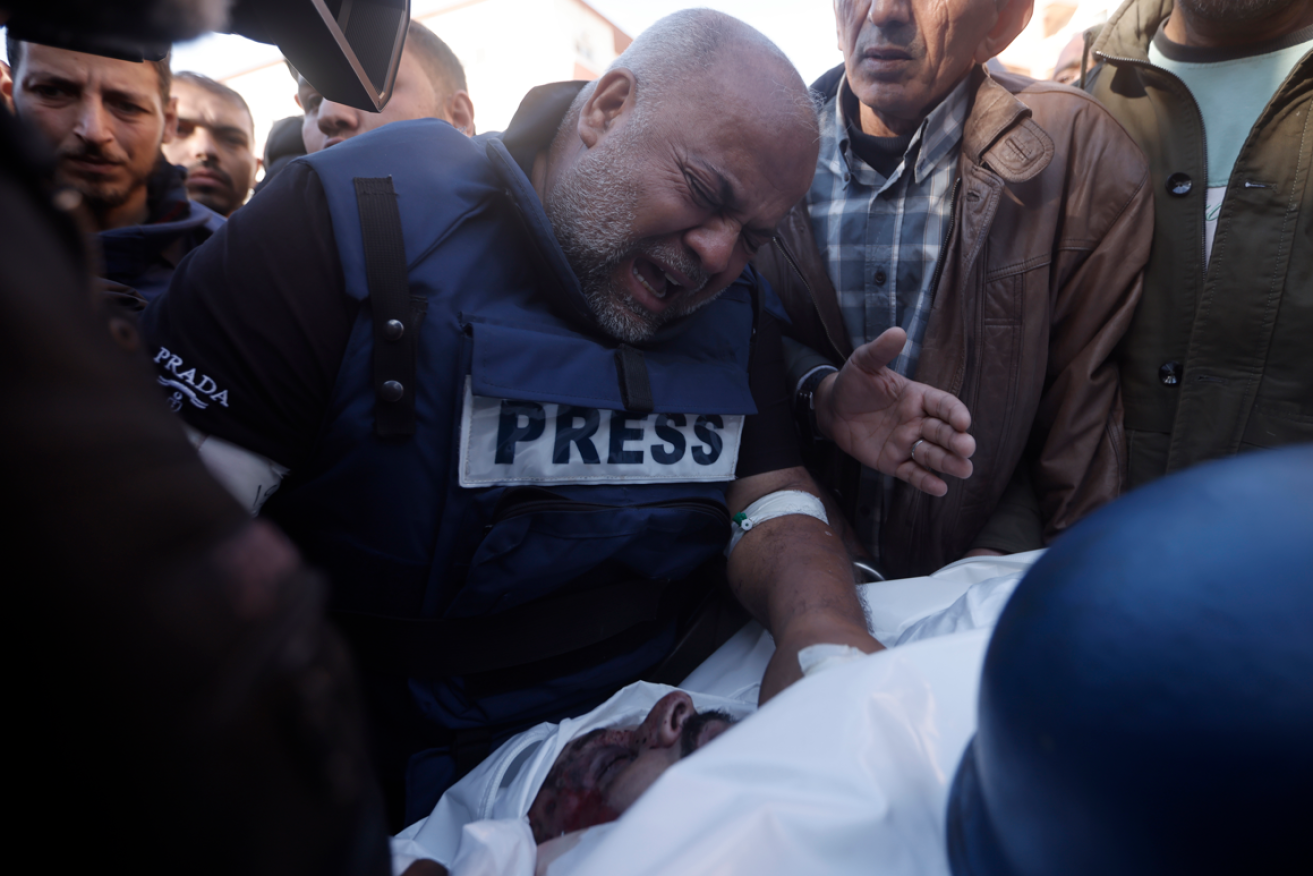 Colleagues surround the mortally wounded Samer Abu Daqqa in southern Gaza.