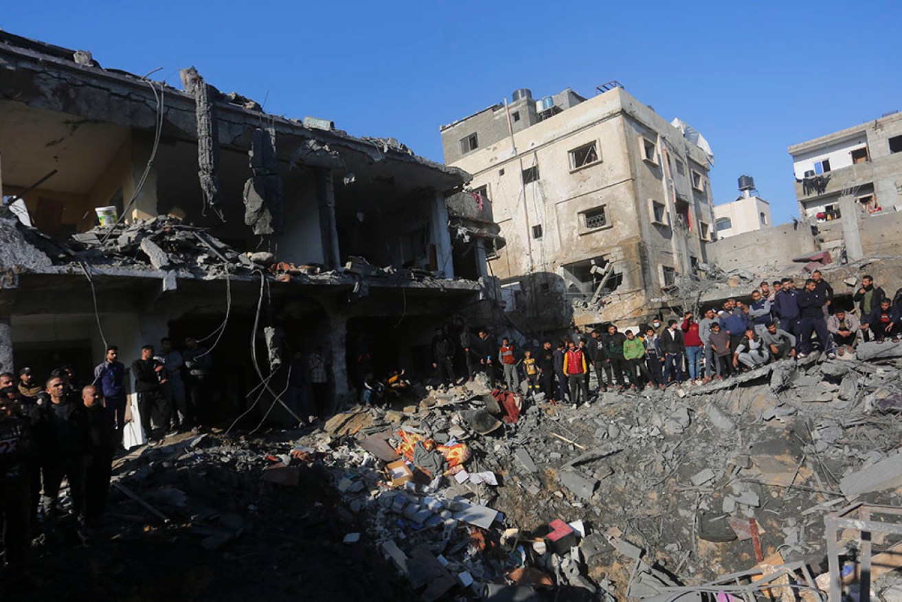 Palestinians survey the destruction at Rafah as Israel continues its bombardment of the Gaza Strip.