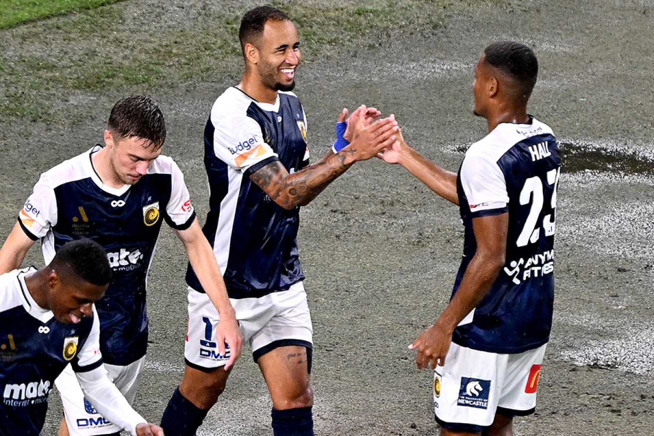 Central Coast’s Marco Tulio enjoys his goal at Suncorp Stadium on Thursday.