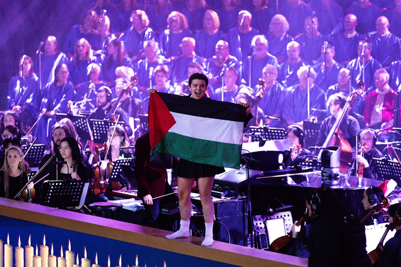 Two Pro-Palestine protesters were quickly overpowered when they interrupted Carols by Candlelight. 