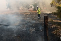 Volunteer firefighter dies, blaze threatens homes