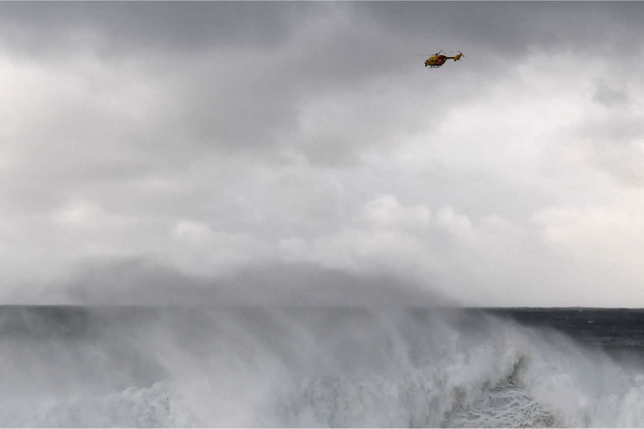 A search has resumed for a 19-year-old man caught in a rip and swept out to sea.