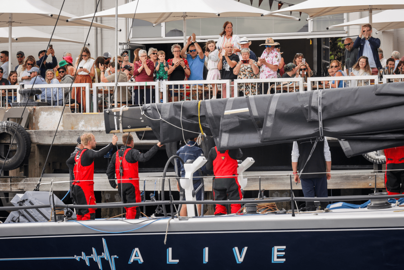 Alive's crew pulls into Constitution Dock in Hobart after claiming its second handicap crown.