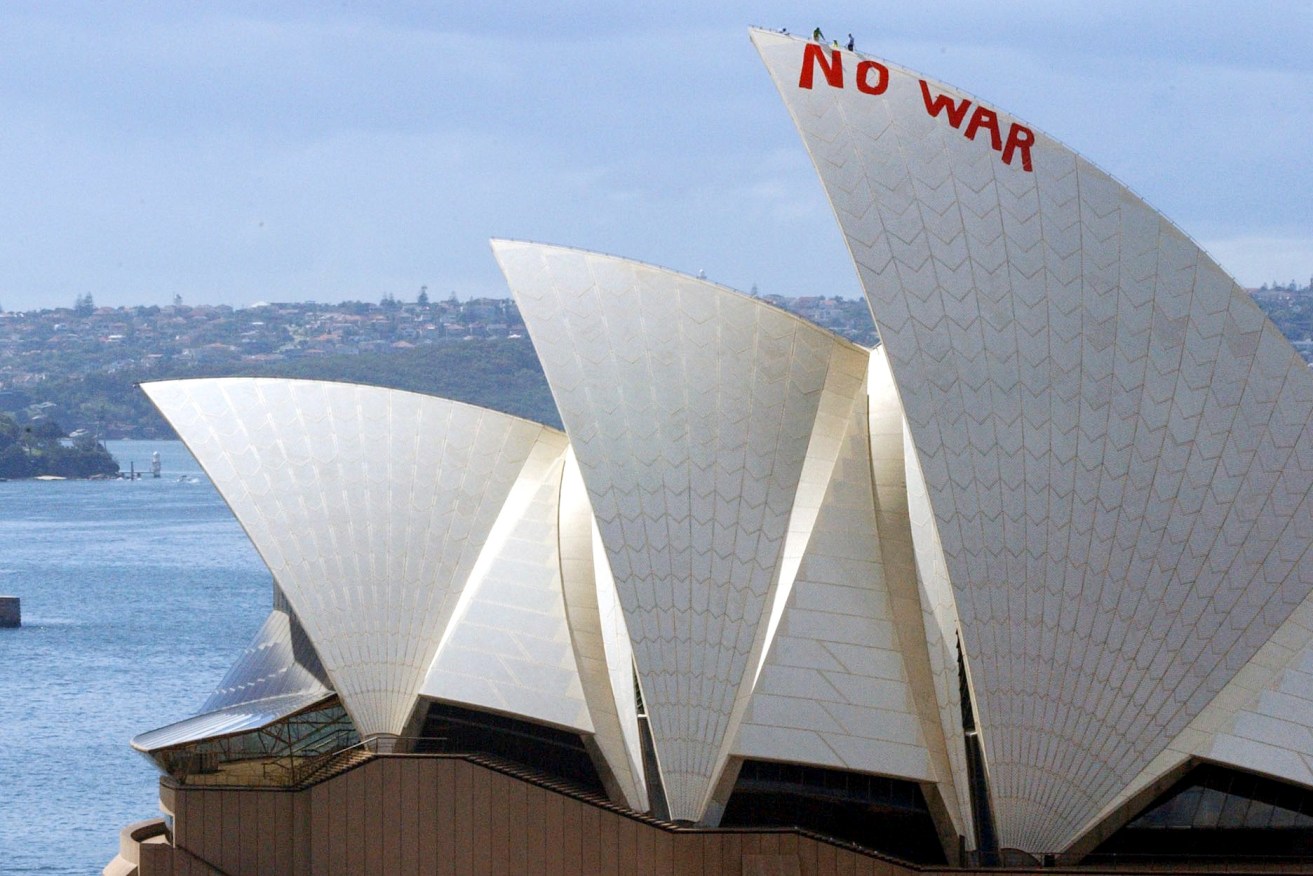 Protesters painted in red the words "no war" on the sails of the Sydney Opera House.