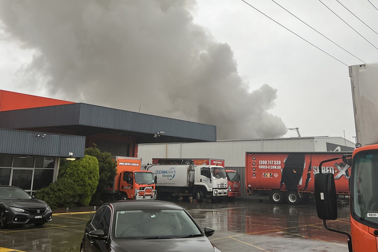 A fire in a large pile of scrap metal at a recycling plant has sent smoke across Melbourne. 