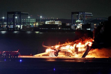 Passengers escape after Japan Airlines plane catches fire at Haneda airport