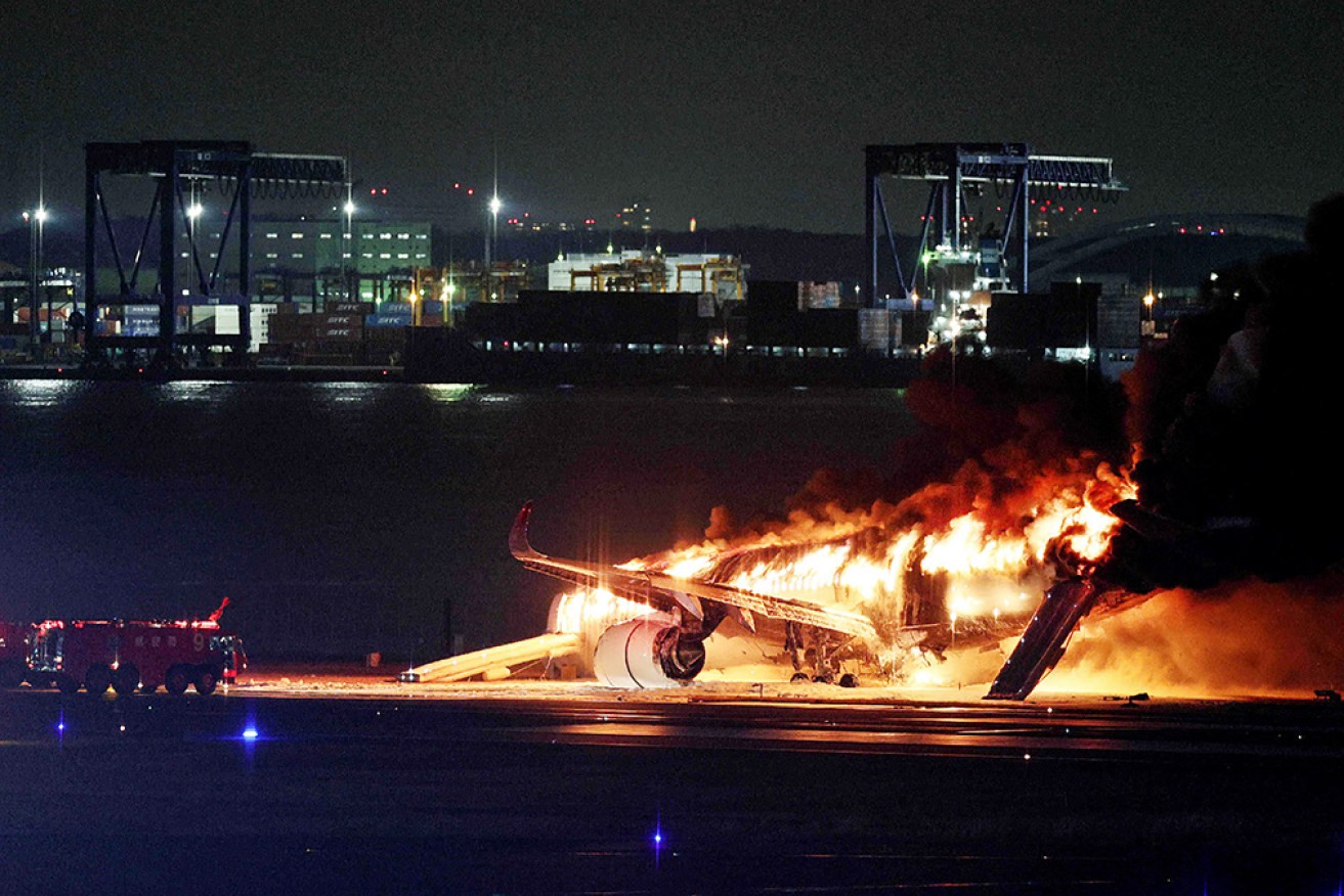 The passenger jet was consumed by fire after everyone on board was evacuated.