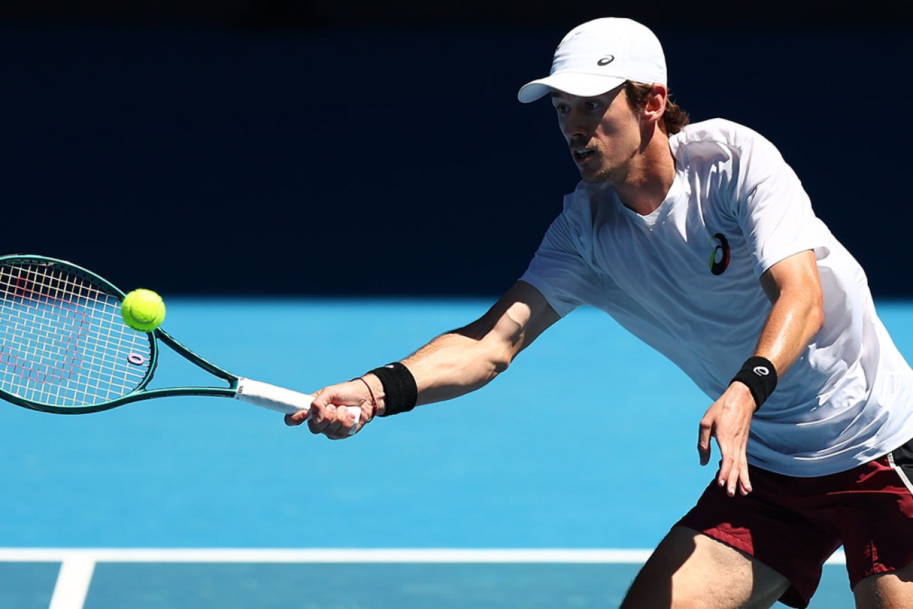 Alex de Minaur is drawn to face the dangerous Milos Raonic in the Australian Open first round.