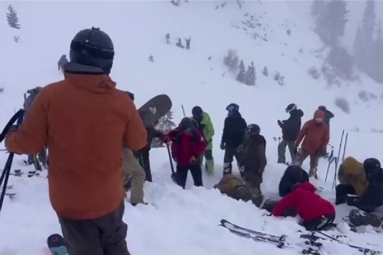 Digging for people trapped under the snow after the avalanche. 