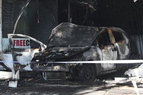 Trio arrested after tobacco shop burns