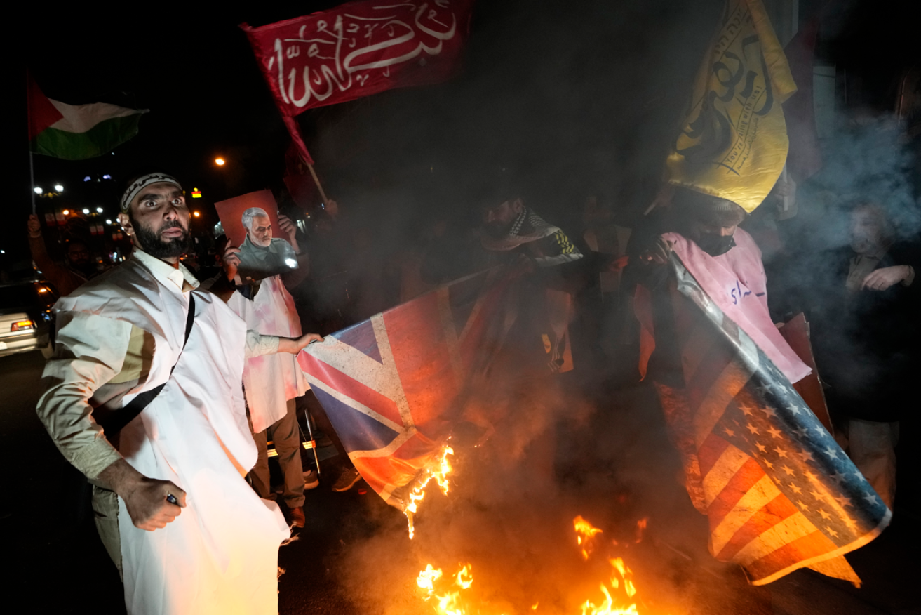 Yemenis burn US and British flags as a second-wave attack hit the country's radar system