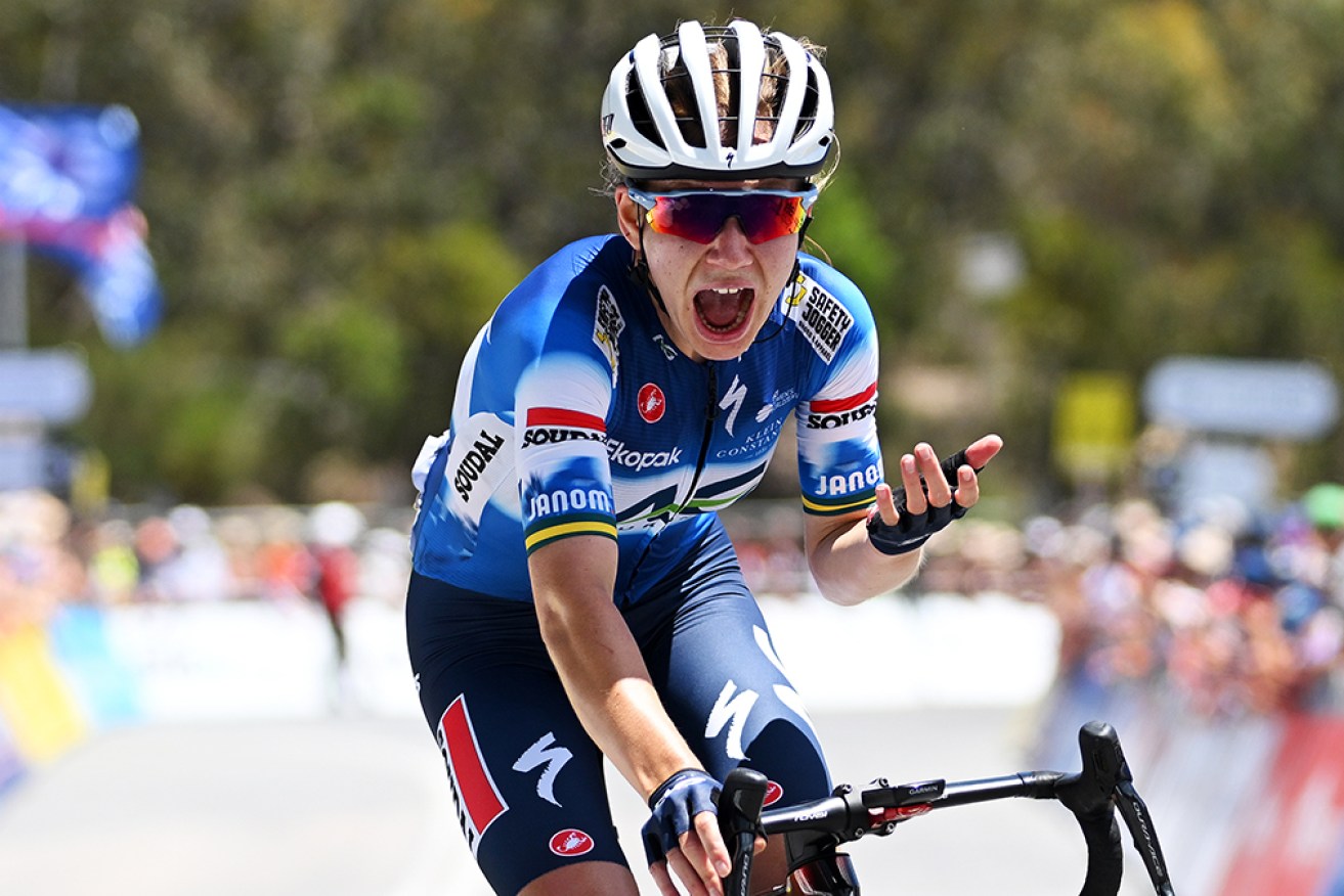 Sarah Gigante shows her elation at clinching the Tour Down Under title at the top of Willunga Hill. 