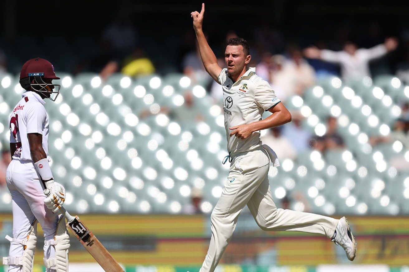 Josh Hazlewood takes the wicket of Alick Athanaze on Thursday at Adelaide Oval. 