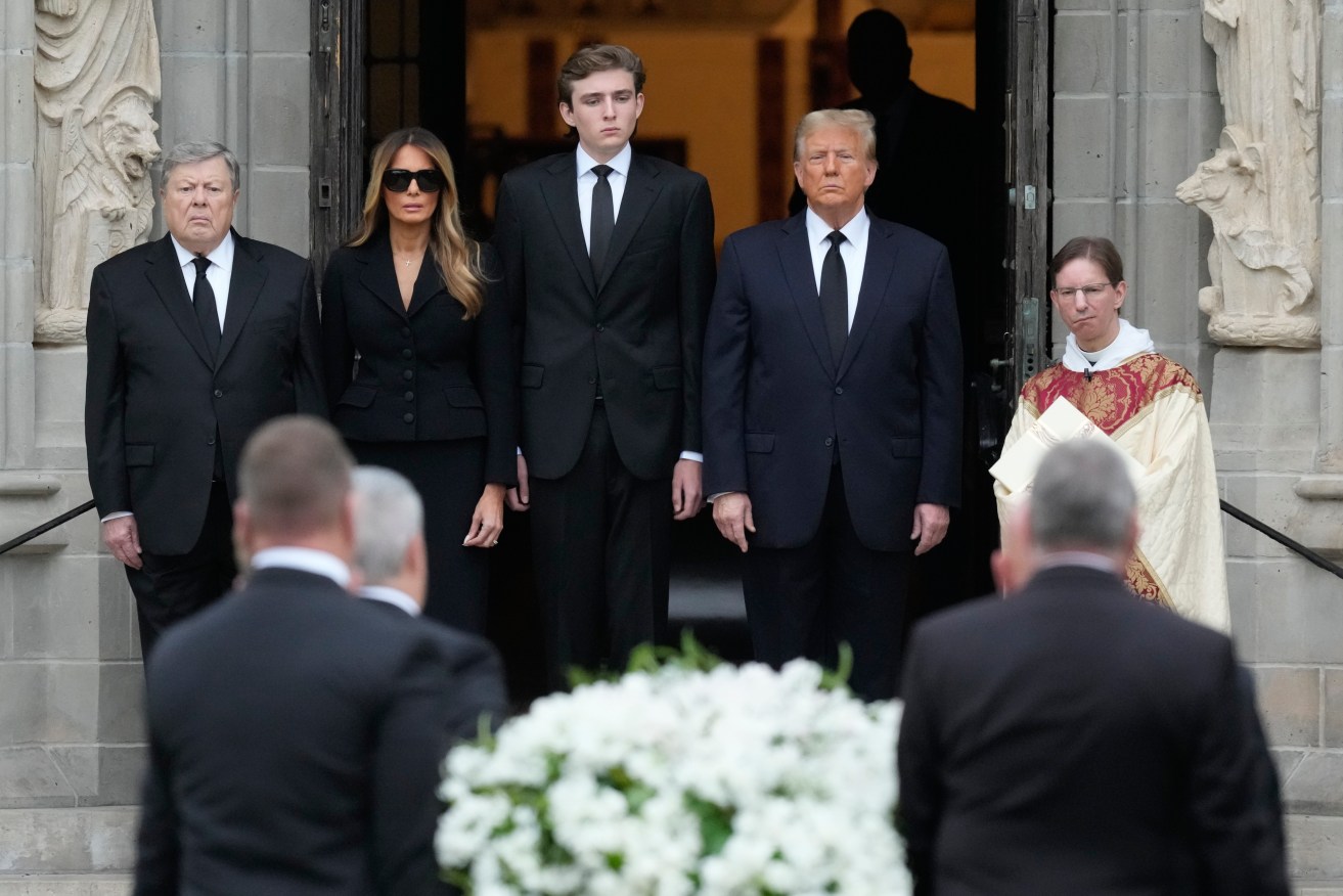 Melania, Barron and Donald Trump, with her father Viktor Knavs, at the funeral for her mother.