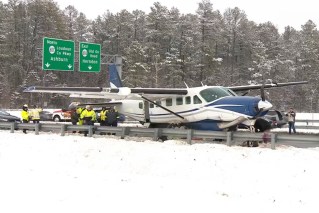 Disabled plane drops in on busy US highway