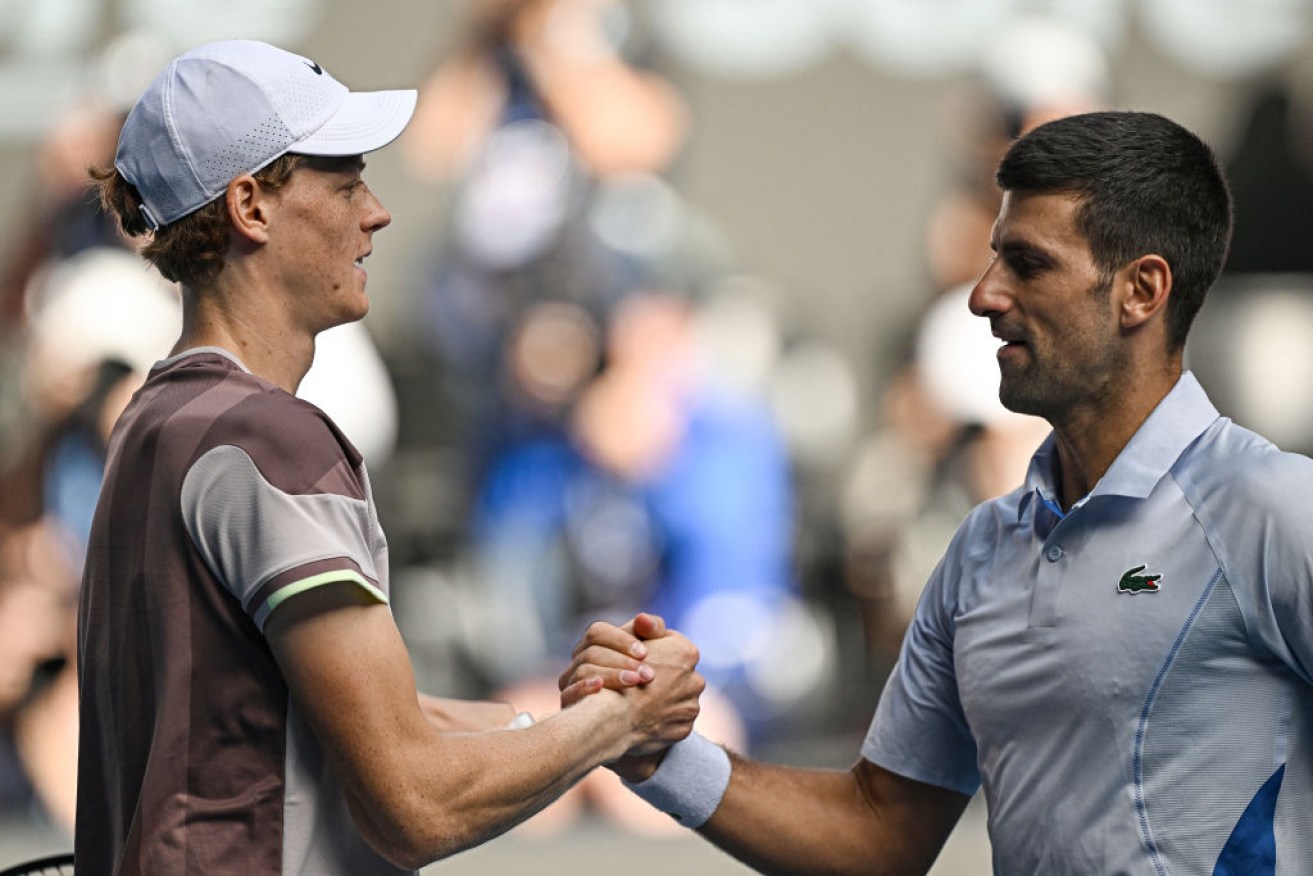 Italy's Jannik Sinner greets Serbia's Novak Djokovic after victory in their semi-final match. 