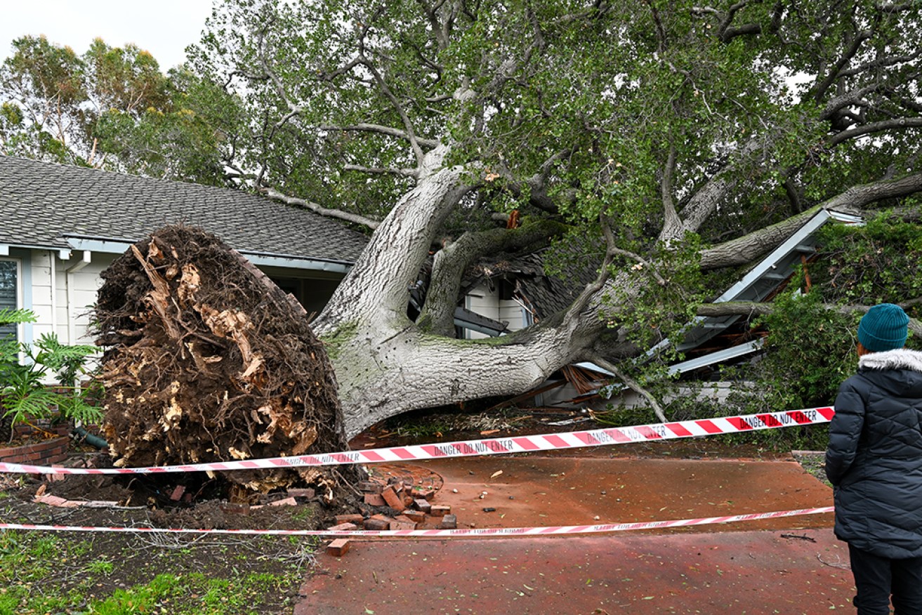 Storms have lashed California, causing widespread flooding, felling trees and cutting power for thousands.