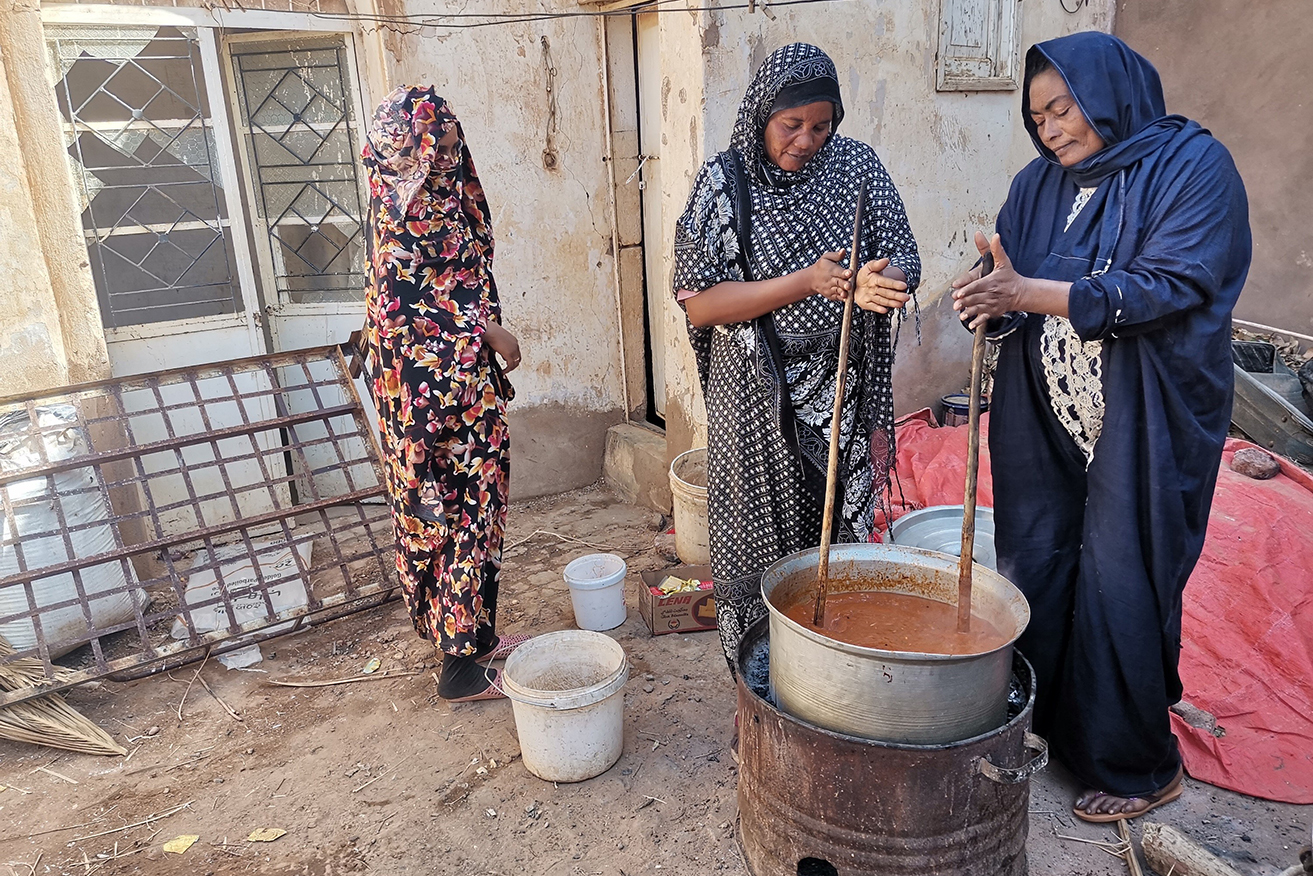 Volunteers cook food for free distribution in Omdurman, Sudan.