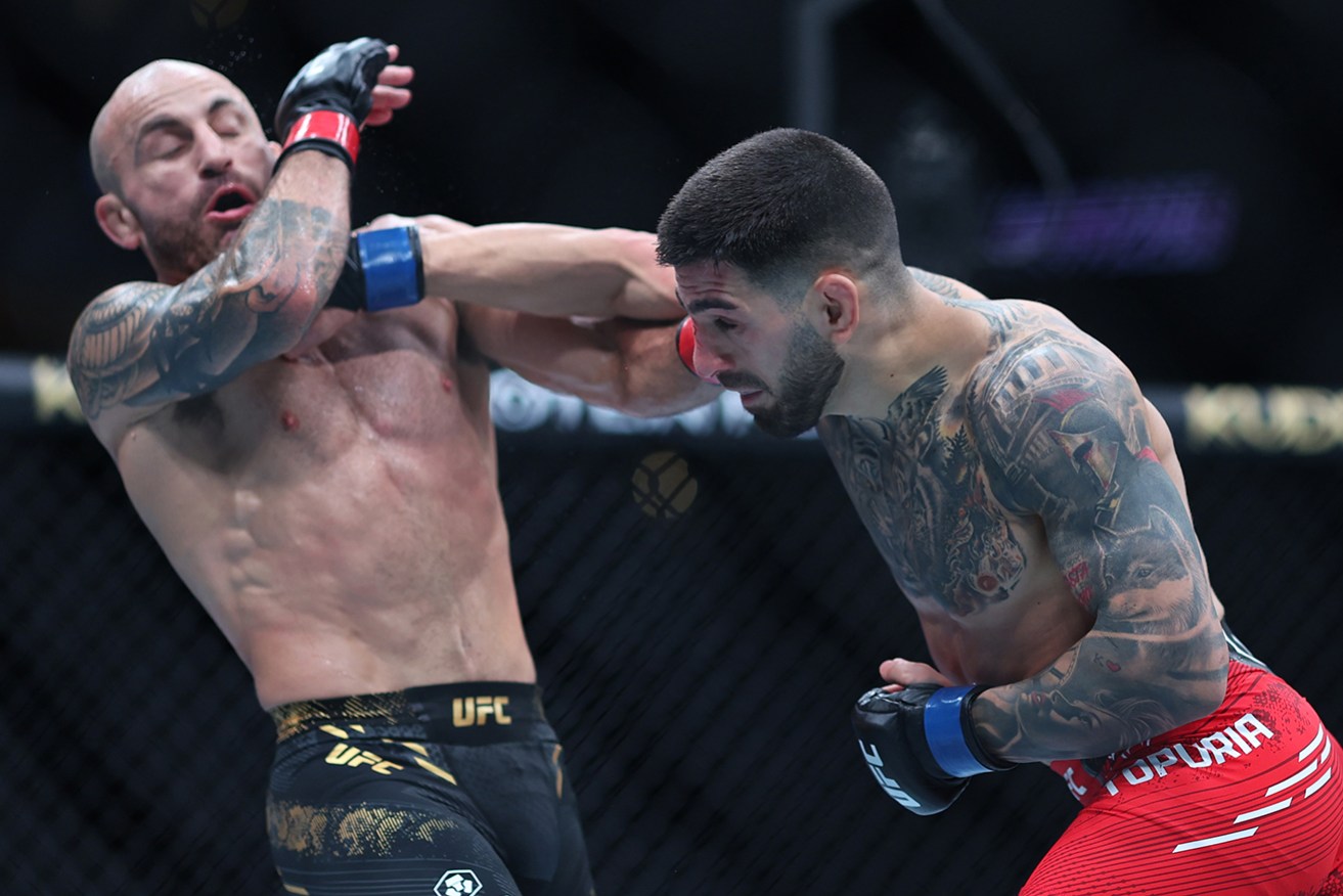 Ilia Topuria lands a heavy bow on Alexander Volkanovski in Sunday’s featherweight title fight at UFC 298 n Anaheim, California.