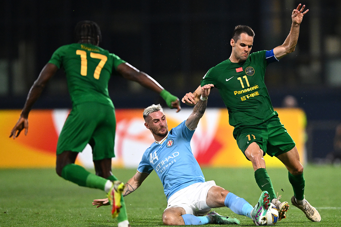 Zhejiang FC’s Franko Andrijasevic is tackled by Melbourne City’s Marin Jakolis in the AFC Champions League in December. 
