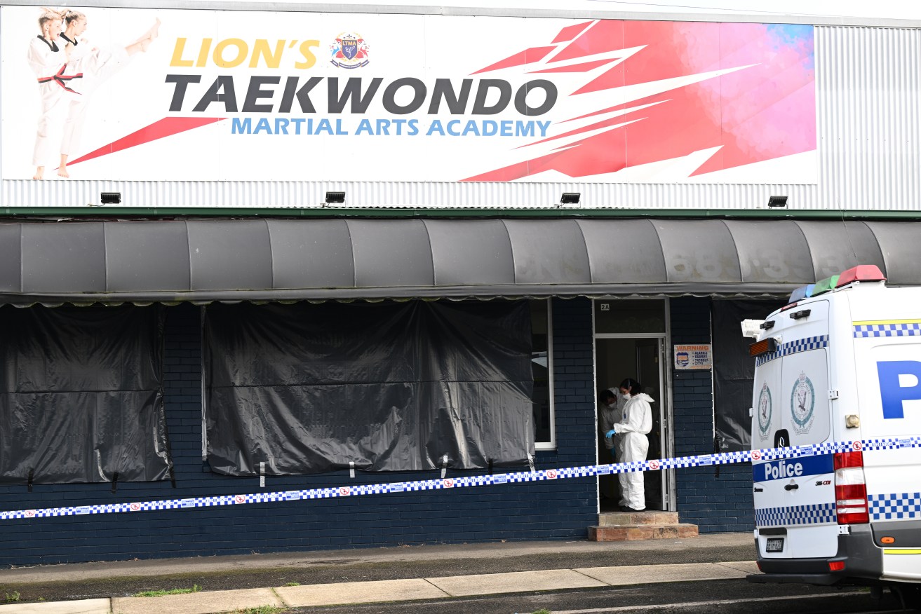 A taekwondo instructor accused of murdering a boy and his parents remains in hospital.