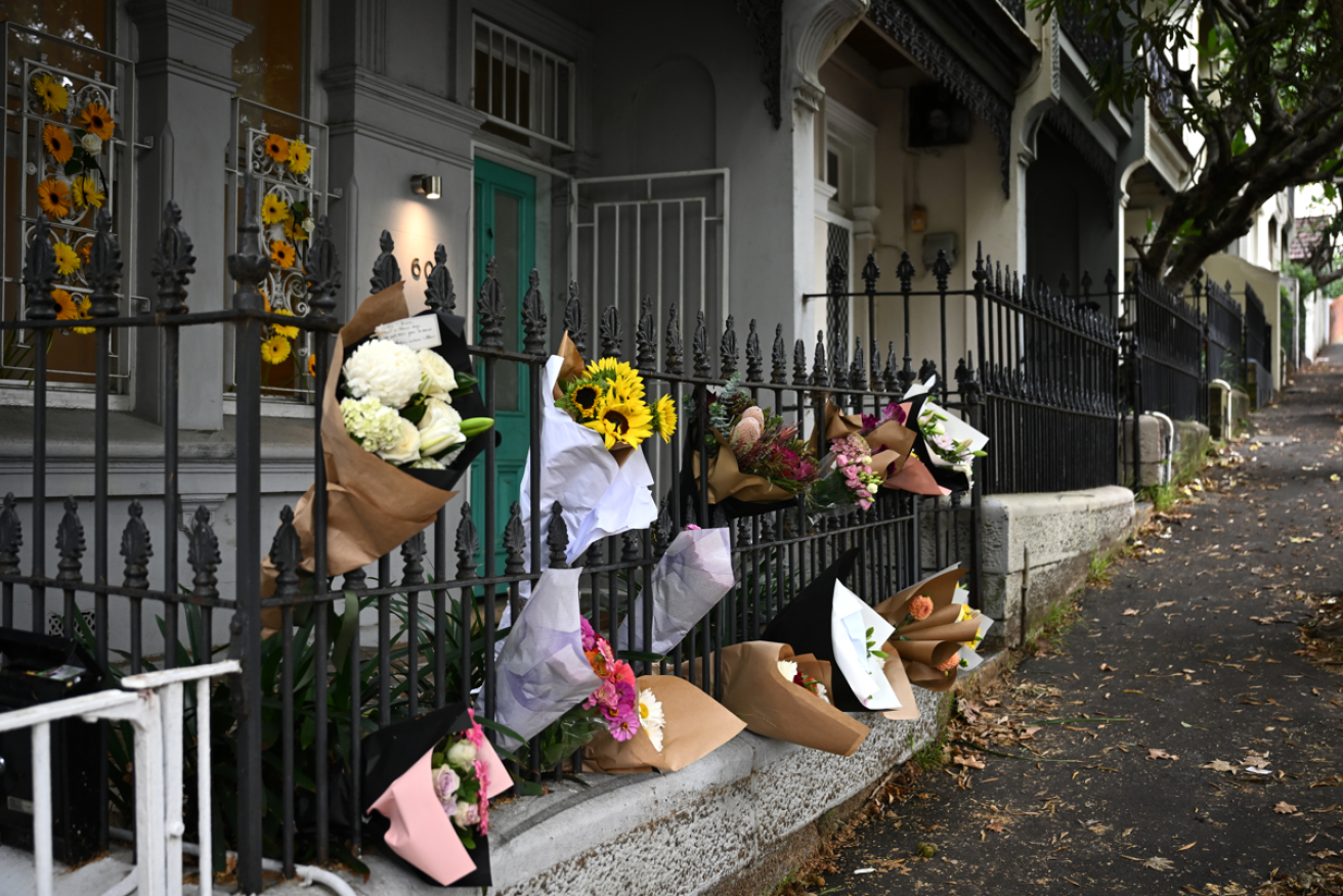 Neighbours' tributes outside the house where the young couple's lives were snuffed out.
